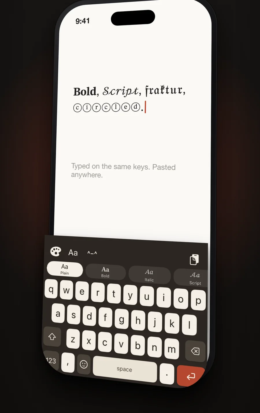 The AWKey style strip open above the keys, with bold, script and fraktur text typed into a note